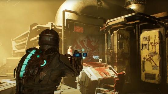 In the Dead Space remake, armoured protagonist Isaac points his laser cutter toward an electrical panel flooded with yellow light, which illuminates messages of 'help' written in streaks of blood.