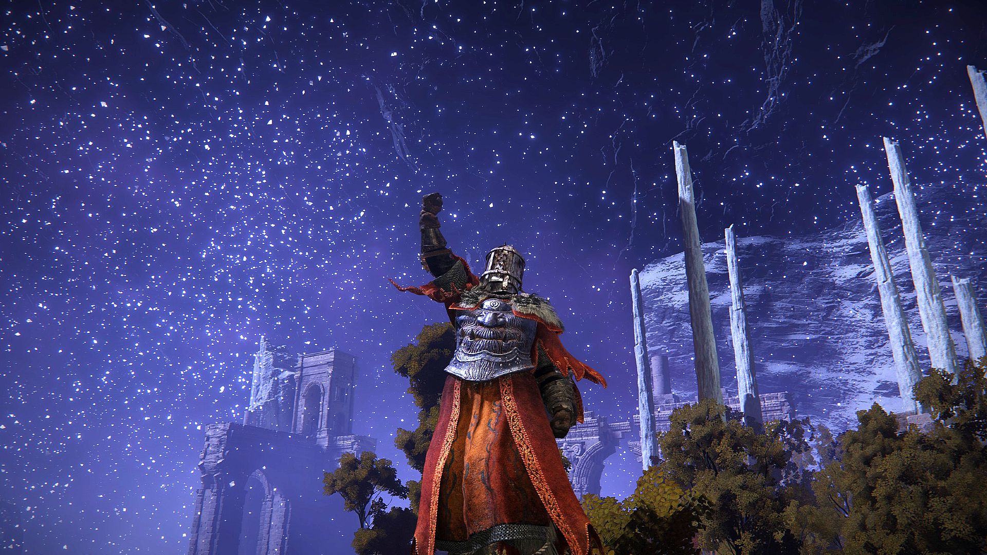 Elden Ring dying twice: a heavily armoured player performing an emote in which they punch the air, there's a starry night backdrop behind them