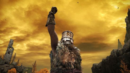 Elden Ring dying twice: a heavily armoured player performing an emote in which they punch the air, there's a bright orange sky behind them