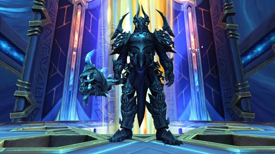 WoW patch: the Jailer from the Sepulcher of the First Ones raid towers over the player in a hall