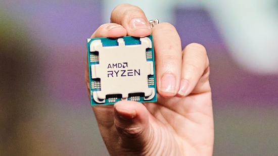 Hand holding AMD Ryzen 7000 CPU