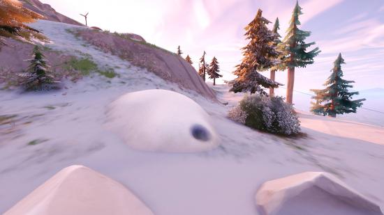 Fortnite Klombo snow mound locations: a mound of snow with a blow hole in it.
