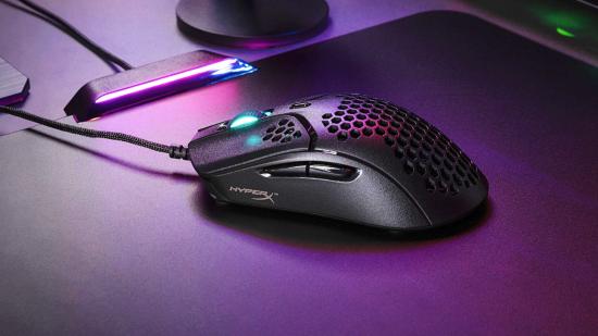 HyperX Pulsefire Haste: The ultra-light gaming mouse rests atop a mouse pad, with its single lighting zone illuminated with blue light