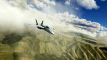 An F/A-18 Super Hornet flies over arid mountains in Microsoft Flight Simulator