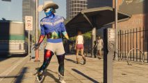A man with skin that looks like a scene from outer space stands on a street corner in Saints Row.