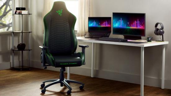Razer Iskur X gaming chair with dual monitors on right sitting in generic office room