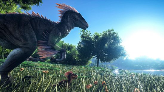 Best dinosaur games: a feathered dino stalks through grassy fields in Ark: Survival Evolved 
