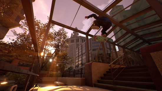 Best skateboard games: a skateboarder performs a trick overhead with skyscrapers in the background in Session: Skate Sim