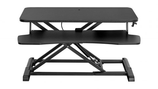 The Vivo Desk Converter is matte black with two tiers, seen here against a white background