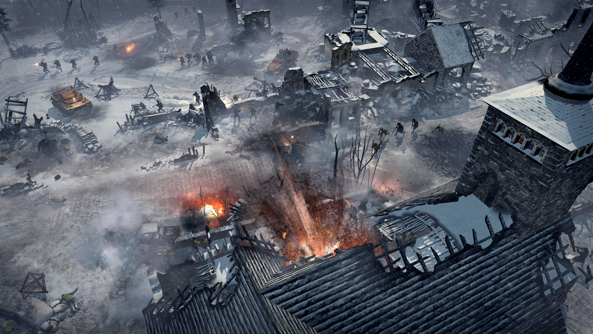 Best war games: Company of Heroes 2: Ardennes Assault. Image shows soldiers in a cold barren landscape seen from above.
