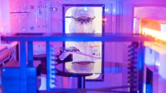 Intel employees in clean room "bunny suits" work at Intel's D1X factory in Hillsboro, Oregon. The grand opening of D1X's "Mod3" in 2022 will provide Intel engineers with an additional 270,000 square feet of clean room space to develop next-generation silicon process technologies. (Credit: Intel Corporation)