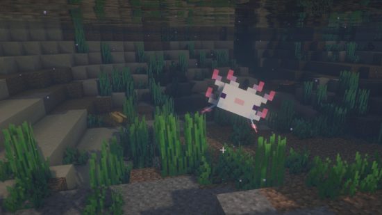 A cyan Minecraft axolotl plays dead in the water after being hit
