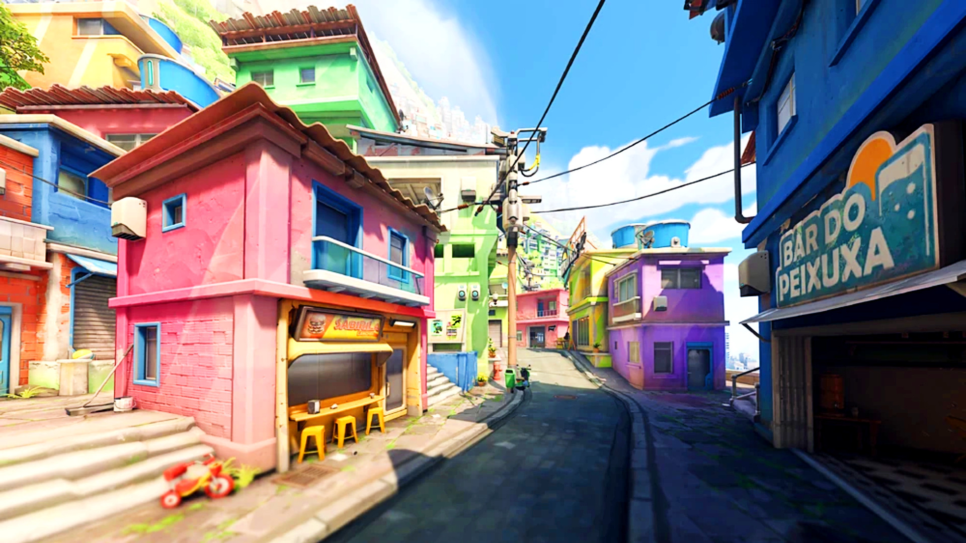 Overwatch 2 map Paraiso - narrow city streets winding between several brightly-coloured houses