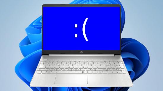 Laptop with sad text face and Windows 11 artwork in backdrop