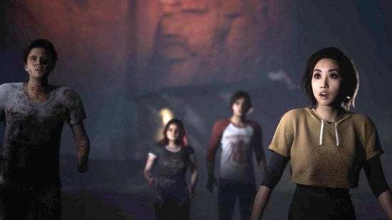 Reparto y personajes de The Quarry: varios monitores de campamento caminan por una cueva.
