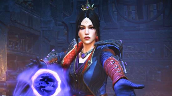 The best Diablo Immortal builds: A female Wizard conjuring an orb of blue energy