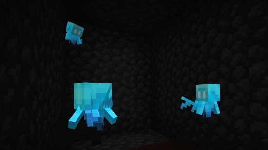 Where to find Minecraft allay: Three glowing blue allays are locked in a dark Woodland Mansion cage room