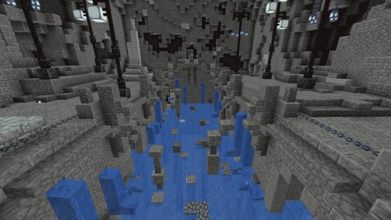 Best Minecraft mods - inside a cavernous vault filled with water, stalagmites, and stalagtites.