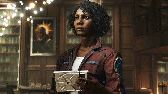 Starfield Character Creation: a Black woman holding a white tablet in a well lit room