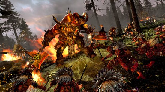 Best Warhammer games - a giant horned demon is yelling at a load of lizardmen as his bull-like brethren charge into battle. Something is exploding behind them.