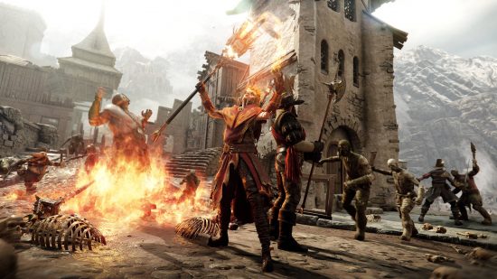 Best Warhammer games - a warrior and a mage stand together surrounded by enemies in Vermintide 2