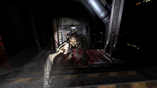 Best horror games: being attacked by a hellish creature in Doom 3