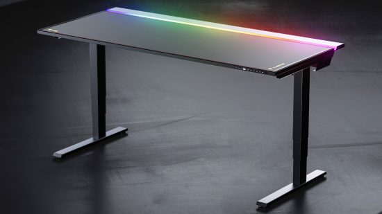 The Secretlab Magnus Pro XL gaming desk stands tall with RGB light shining in the cable tray