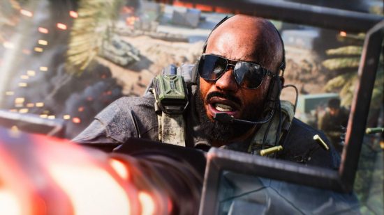 Battlefield 2042 Season 2 update patch notes: Specialist Charlie Crawford, wearing dark aviator sunglasses, fires a mounted Vulcan minigun.
