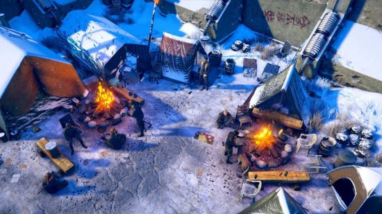 Best RPG games - survivors have set up camp and two fires near some city walls in Wasteland 3.