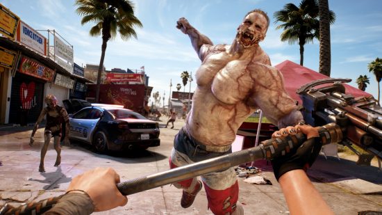 Dead Island 2 release date: A huge body buider zombie flings itself at the player, whose hands can be seen holding a heavy sledgehammer weapon