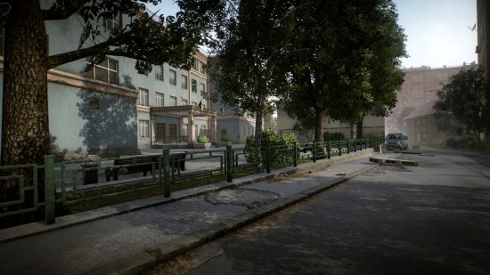 Escape from Tarkov screenshots: A tree-lined parking area in front of a building on a downtown side street