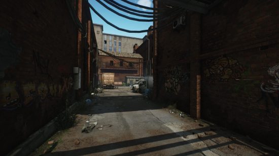 Escape from Tarkov screenshots: An alleyway with cracked pavement and graffiti animals painted on the side of a red brick building