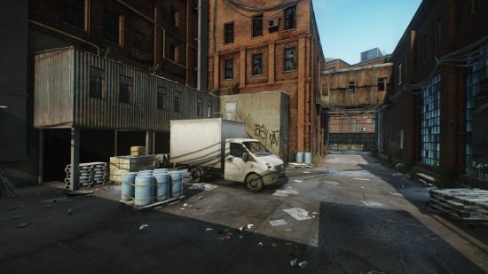 Escape from Tarkov screenshots: A large panel truck in a loading area in an alleyway lined by the walls of a large red brick industrial building