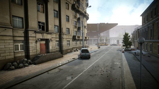 Escape from Tarkov screenshots: An empty city street lined with abandoned residential buildings and leading to a modern-style museum, with a pickup truck that has crashed into a streetlight on the left side