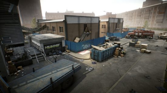 Escape from Tarkov screenshots: A parking area and loading dock, with a dumpster filled with construction debris in the centre. Crashed and burned vehicles can be seen on the far side, and a heap of trash bags is piled up near the entrance to a garage on the near side
