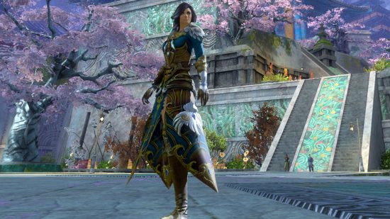 steam guild wars 2 release: end of dragons character stands in japanese-style area with cherry blossoms and jade ramp