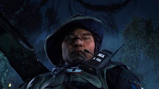 New Rainbow Six Siege operator Grim: Grim, wearing jungle camouflage, looks down at an unconscious enemy in a dark jungle.