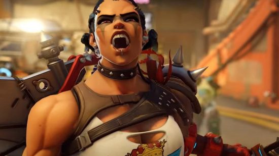Overwatch 2 crossplay: A muscular woman of color shouts in anticipation