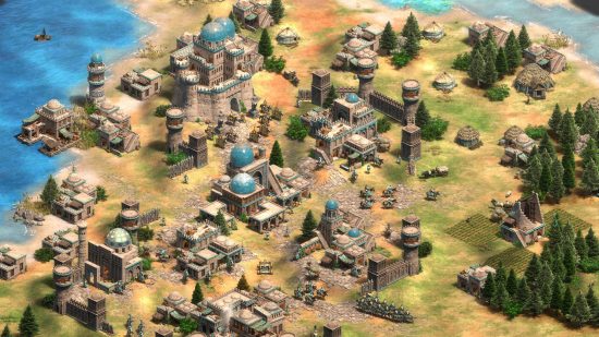 Best Medieval games - a Persian city in Age of Empires 2. Some yellow-bannered units stand near the palace.