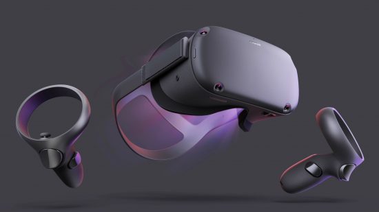 The original Oculus Quest VR headset with its controllers against a grey background
