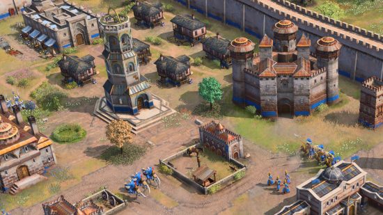 Age of Empires 4 anniversary update: A bustling Ottoman town with a high stone wall in Age of Empires 4