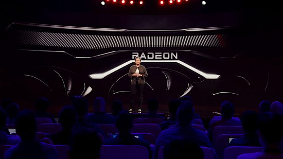 CEO Dr. Lisa Su stands on stage, with an AMD RDNA 3 graphics card towering behind her