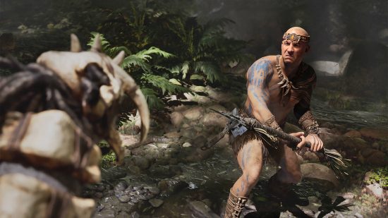 Ark 2 release date: a man who looks like Vin Diesel is brandishing a spear to fight against a dinosaur.