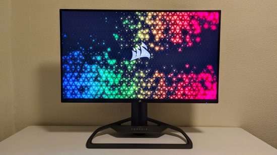 The Corsair Xeneon 32UHD144 gaming monitor sits atop a white desk, against a pale background