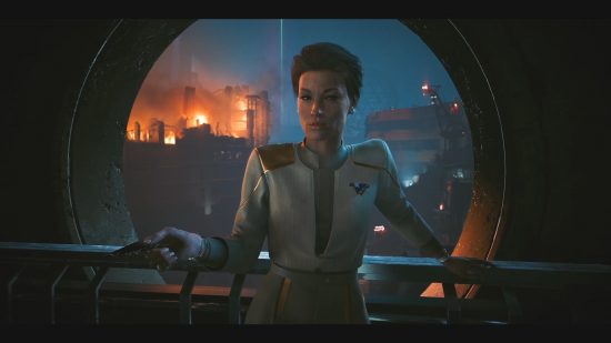 Cyberpunk 2077 Phantom Liberty: A woman of color stands in front of a window that shows a city on fire