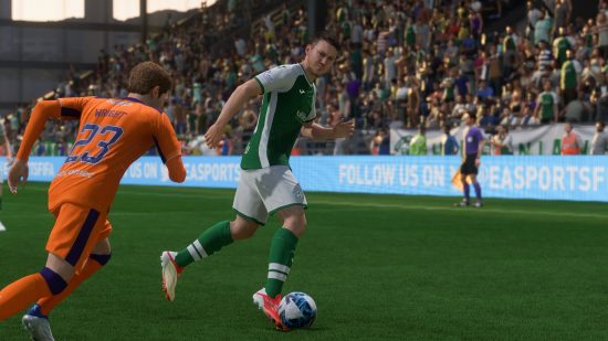 FIFA 23 McGeady Spin Tutorial: A football player spins away from a defender