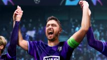 Football Manager 2023 - a player in a purple kit and bright green captain's armband holds his arms aloft, cheering in celebration alongside his fellow teammates in a busy stadium