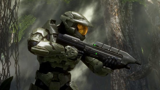 Halo Infinite boss Bonnie Ross departs 343: Master Chief seen in profile in a forest, holding his pulse rifle at the ready