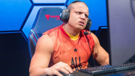 League of Legends streamer Tyler1 hit with remake bug and Riot responds: A bald, muscular man in a red vest top looks confused at a PC monitor