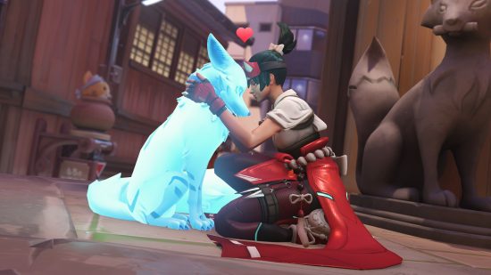 Overwatch 2 free to play model makes devs "much happier": Dark haired girl in tranditional Japanese dress on knees touching her head against a mysterious ghostly fox